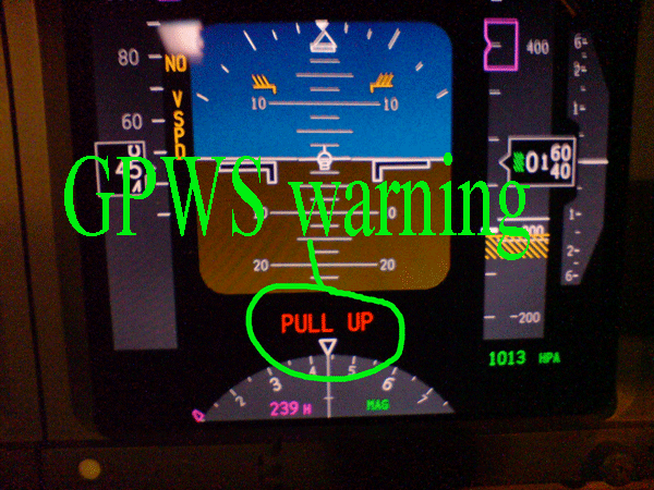 Close up of the dashboard on an airplane, showing the Terrain warning from the ground proximity warning system