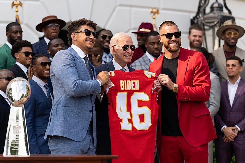 File:Patrick Mahomes and Travis Kelce present President Joe Biden with a commemorative jersey celebrating the team’s Superbowl LVII championship on June 5, 2023, on the South Lawn of the White House - P20230605AS-1420.jpg