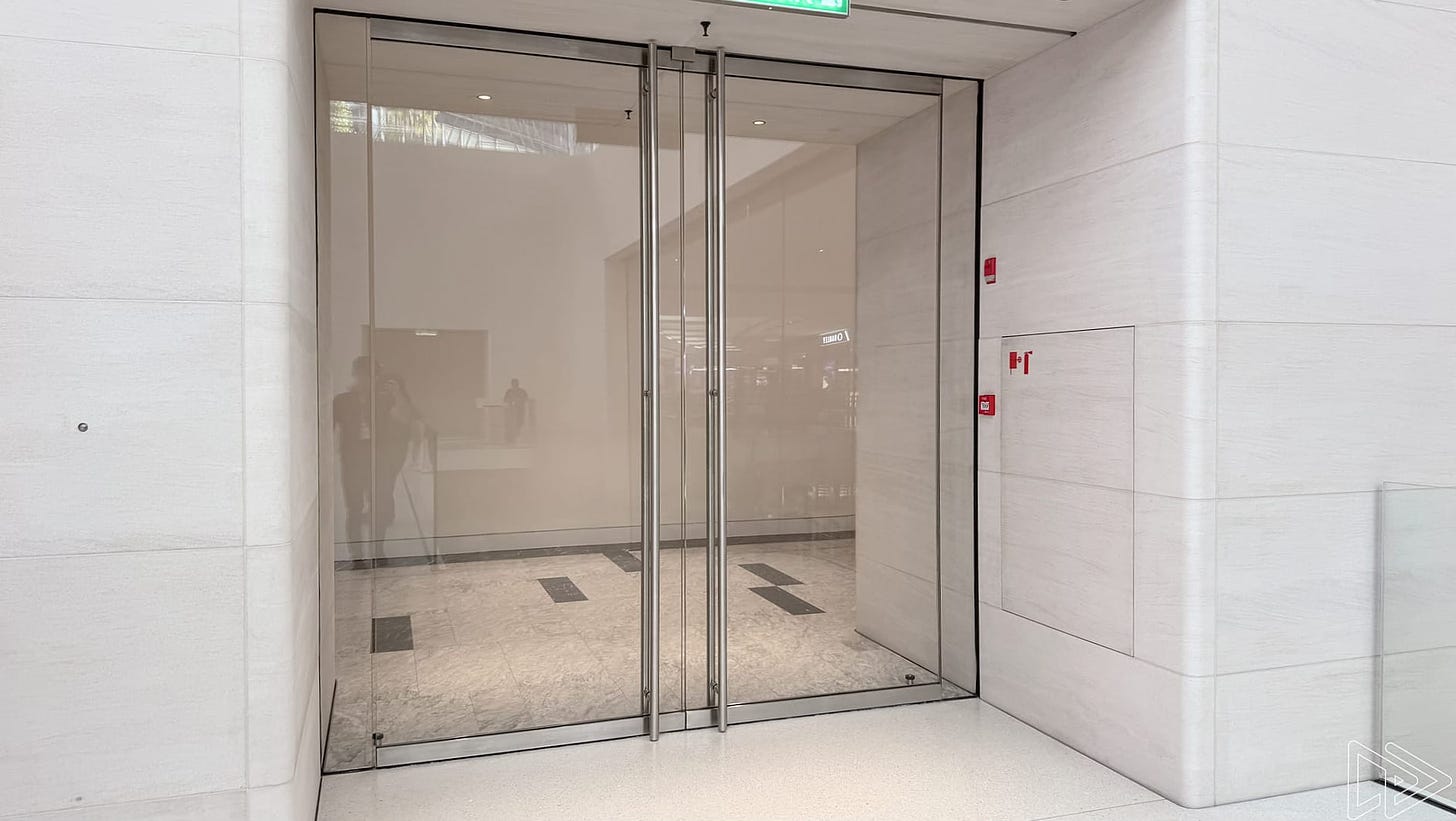 A set of double doors at a side entrance in Apple The Exchange TRX.