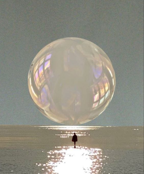 This may contain: a person standing in the water under a large bubble