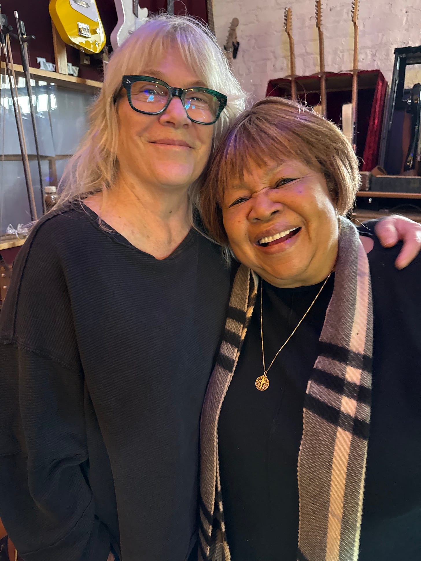 Susie Tweedy and Mavis Staples post for a photo at the Wilco Loft.