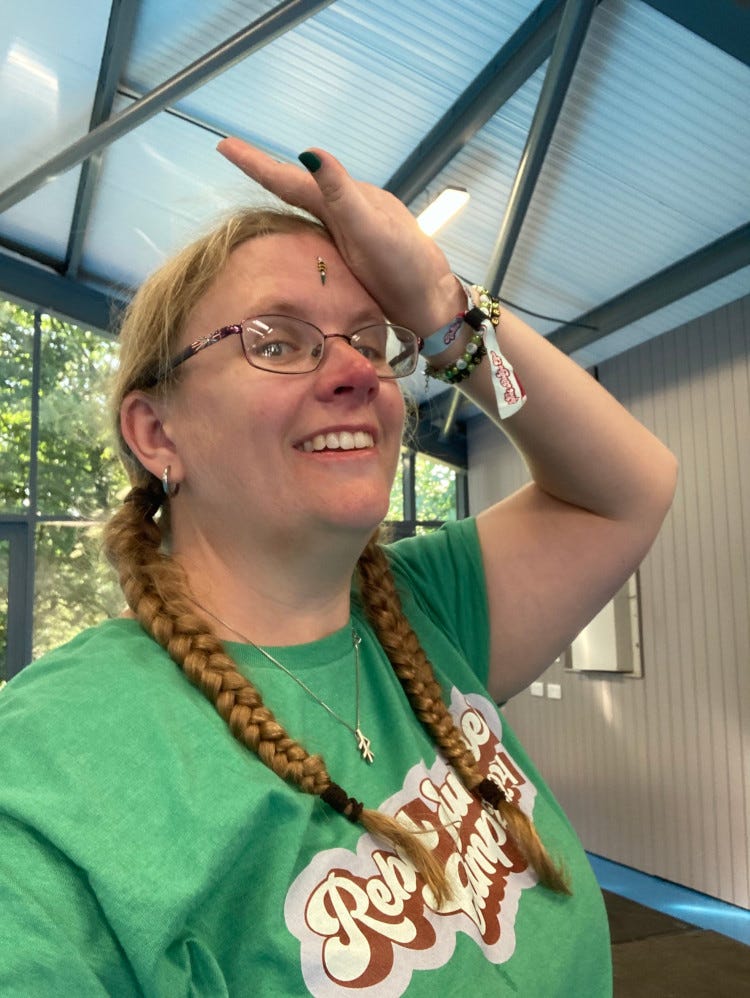 A selfie at the end of Bollywood dancing. I'm wearing a crystal bindi dot on my forehead and doing my best Bollywood pose.