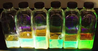 Gold nanoshells under UV light. (Rice University)