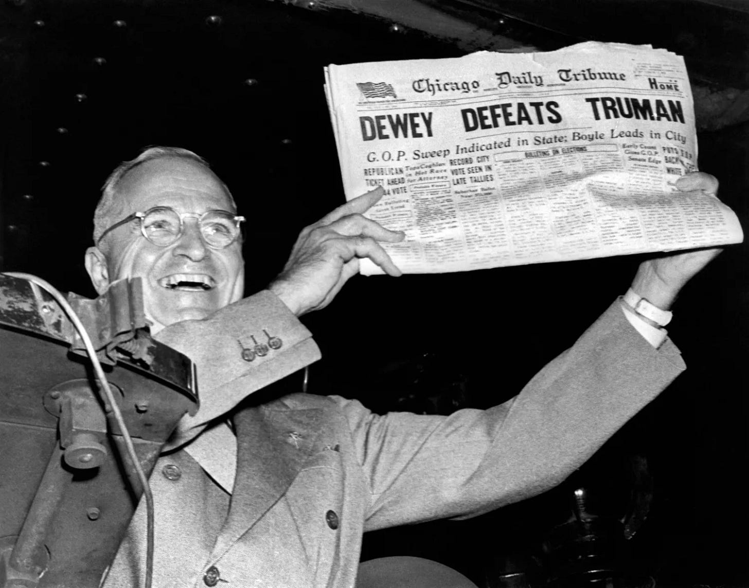 President Harry Truman holding up a newspaper that reads, Dewey Defeats Truman. President Harry Truman holding up a newspaper that reads, Dewey Defeats Truman.