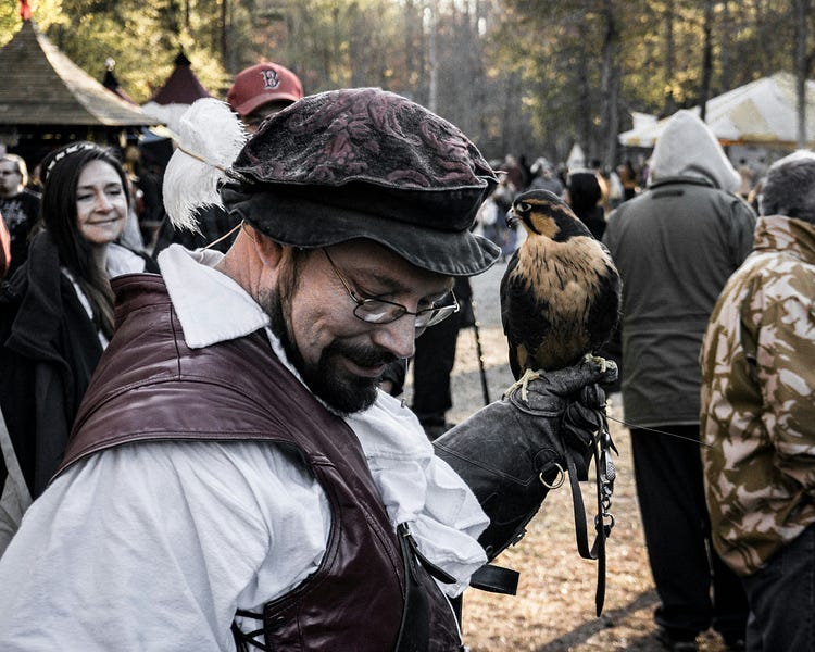 Falconers with falcon.