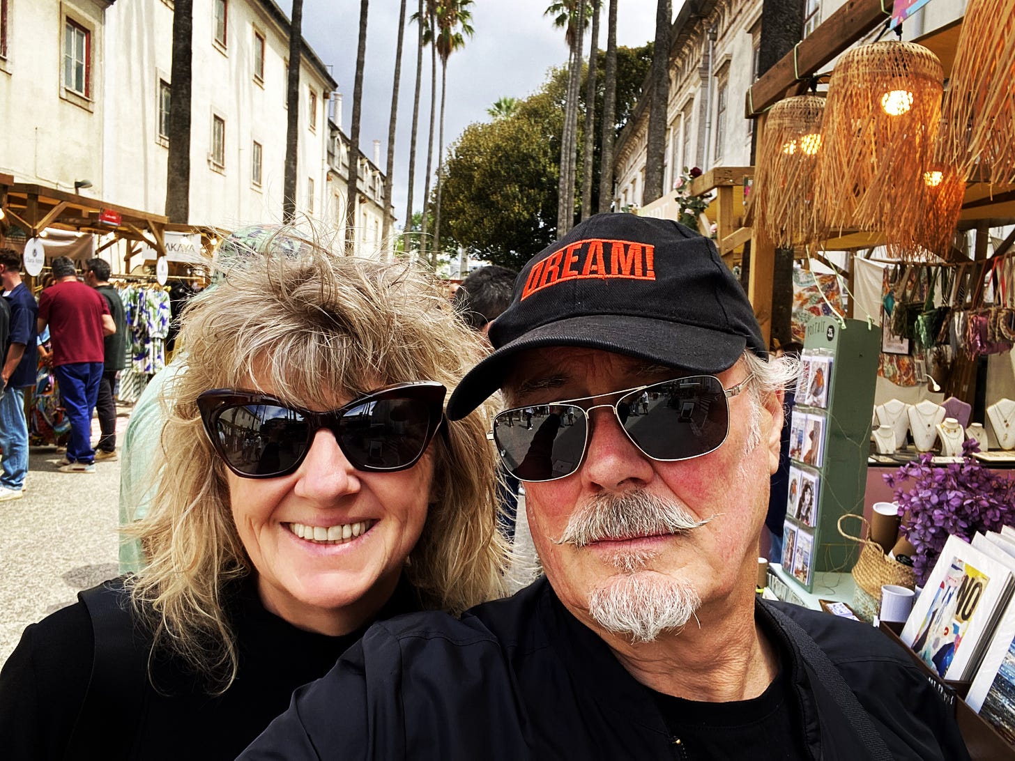Suzy Starlite and Simon Campbell at a market in Lisbon