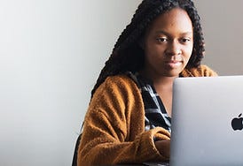 Image by Daniel Thomas of a woman on her laptop