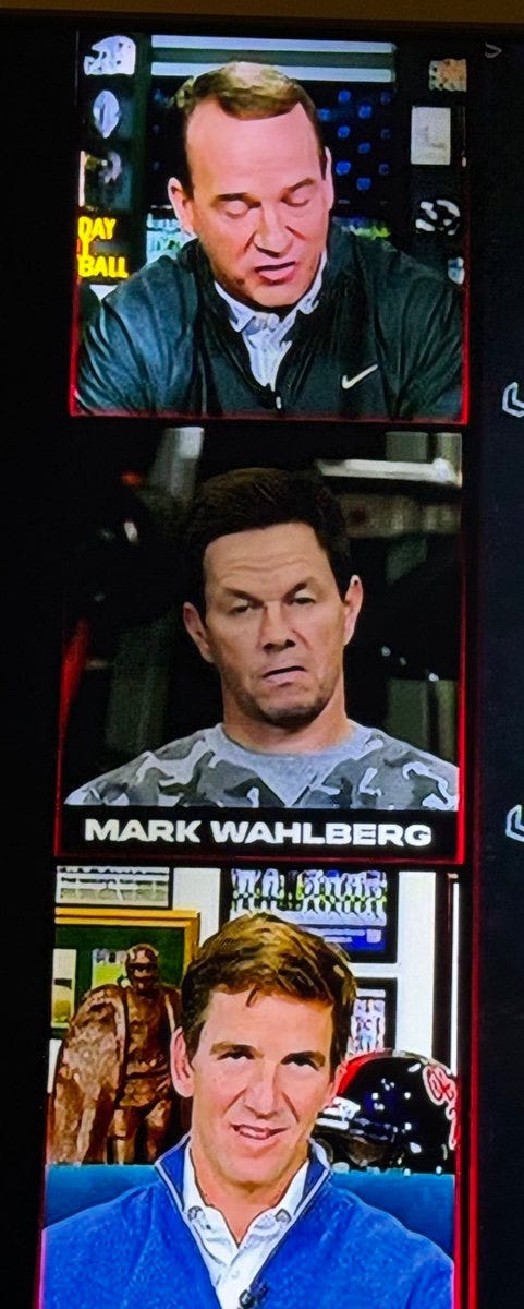 Image from the Manning Cast showing Peyton Manning talking up top; Mark Wahlberg looking like someone stole his dog in the middle; and Eli Manning laughing at the bottom