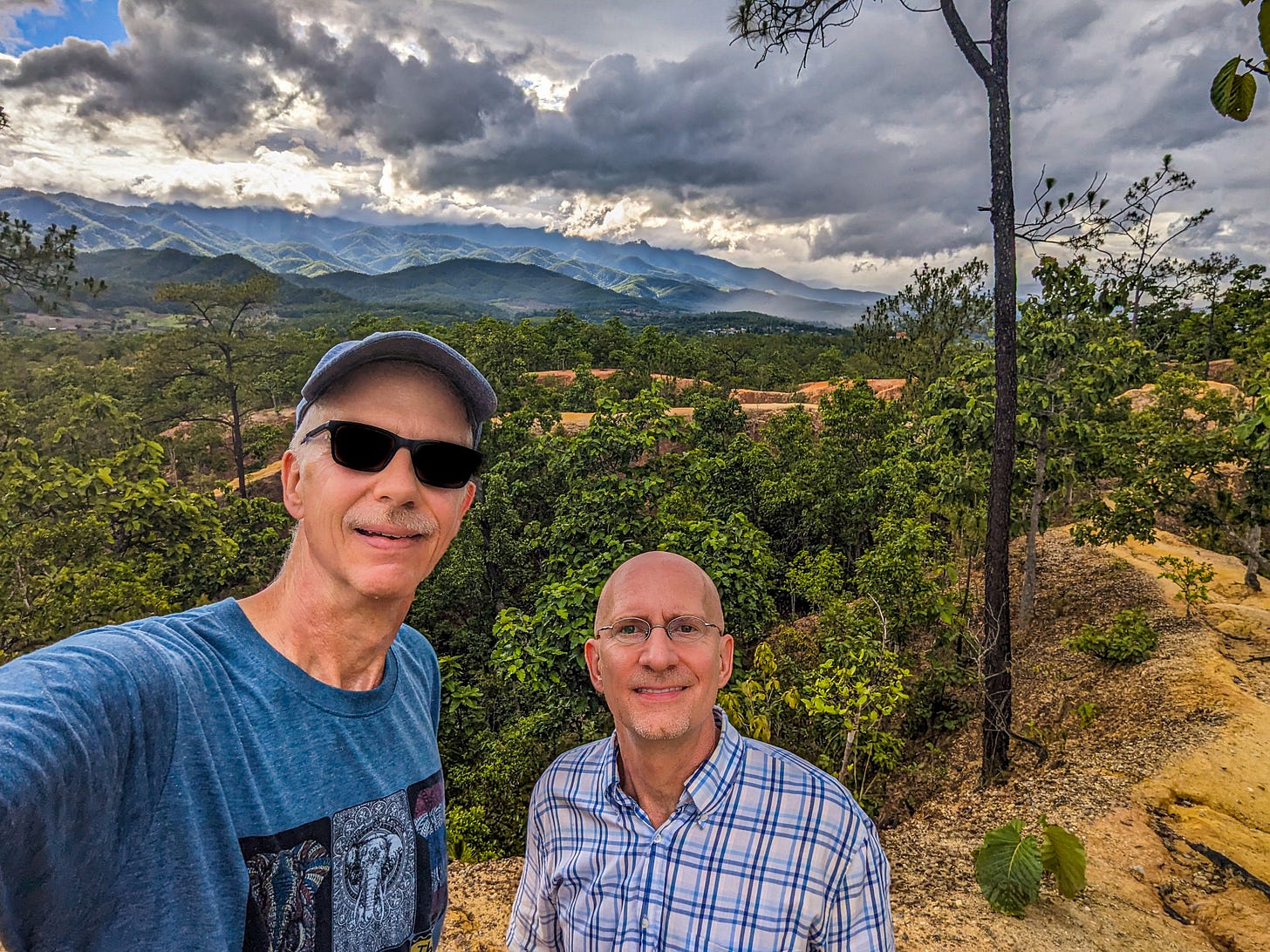 Brent and Michael standing in front of Pai Canyon in Northern Thailand.