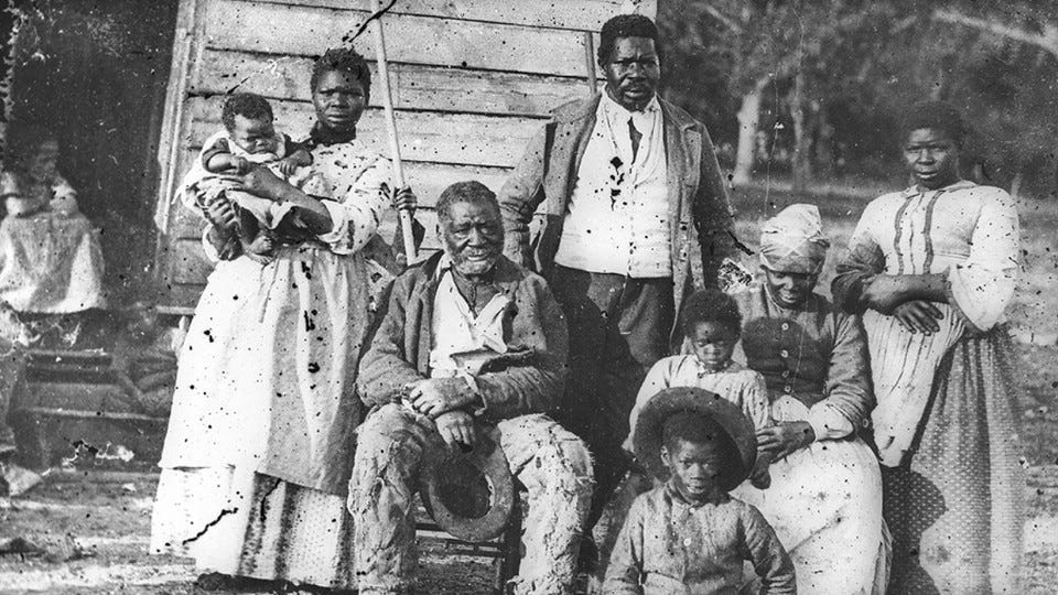 An old photograph of a family of enslaved people on Smith's Plantation An old photograph of a family of enslaved people on Smith's Plantation