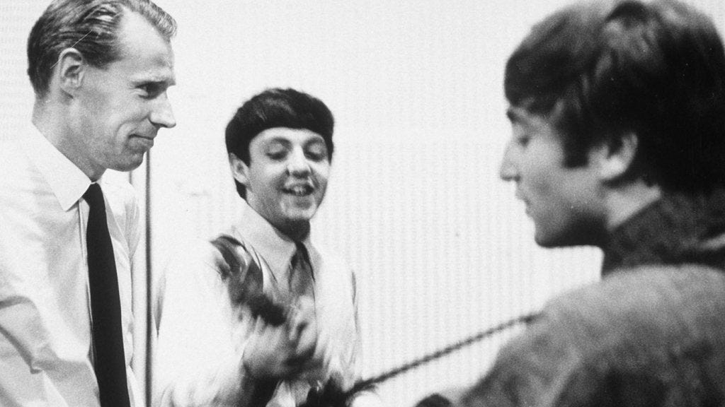 The Beatles in the studio with George Martin