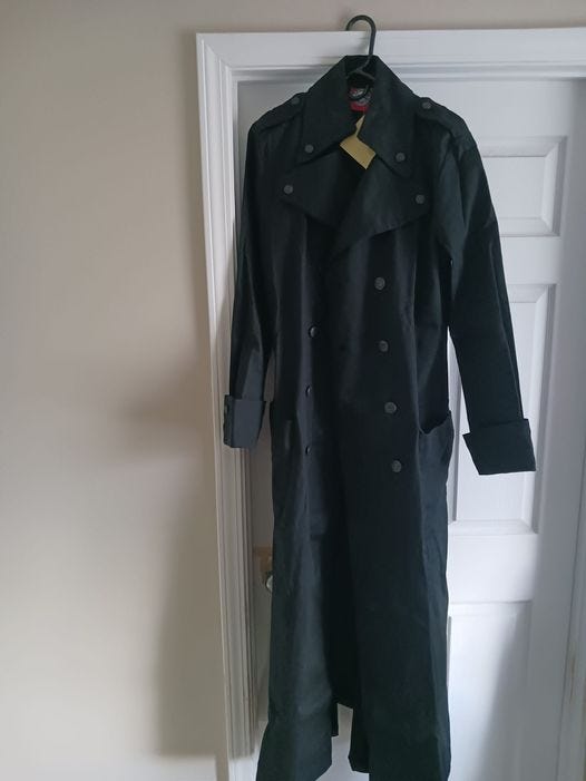 May be an image of duffle coat and overcoat