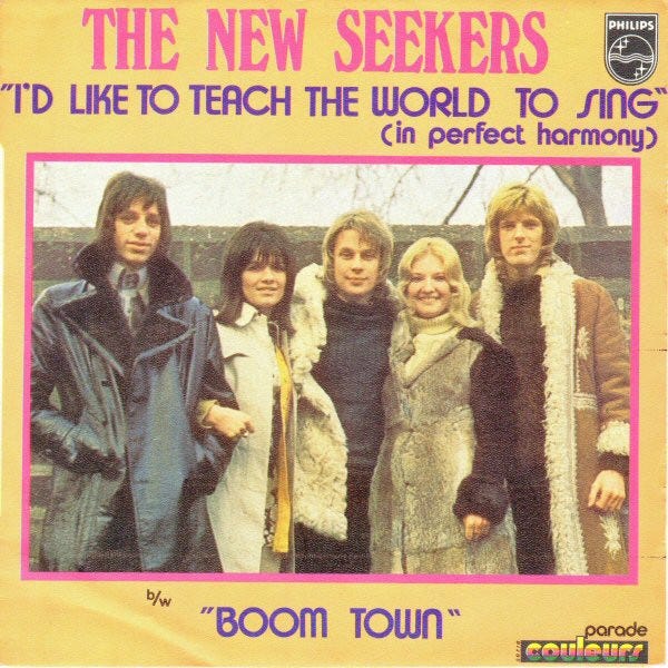 album cover of the band The New Seekers, featuring the song "I'd Like to Teach the World to Sing." Band members are clearly dressed in styles of the 1970s.