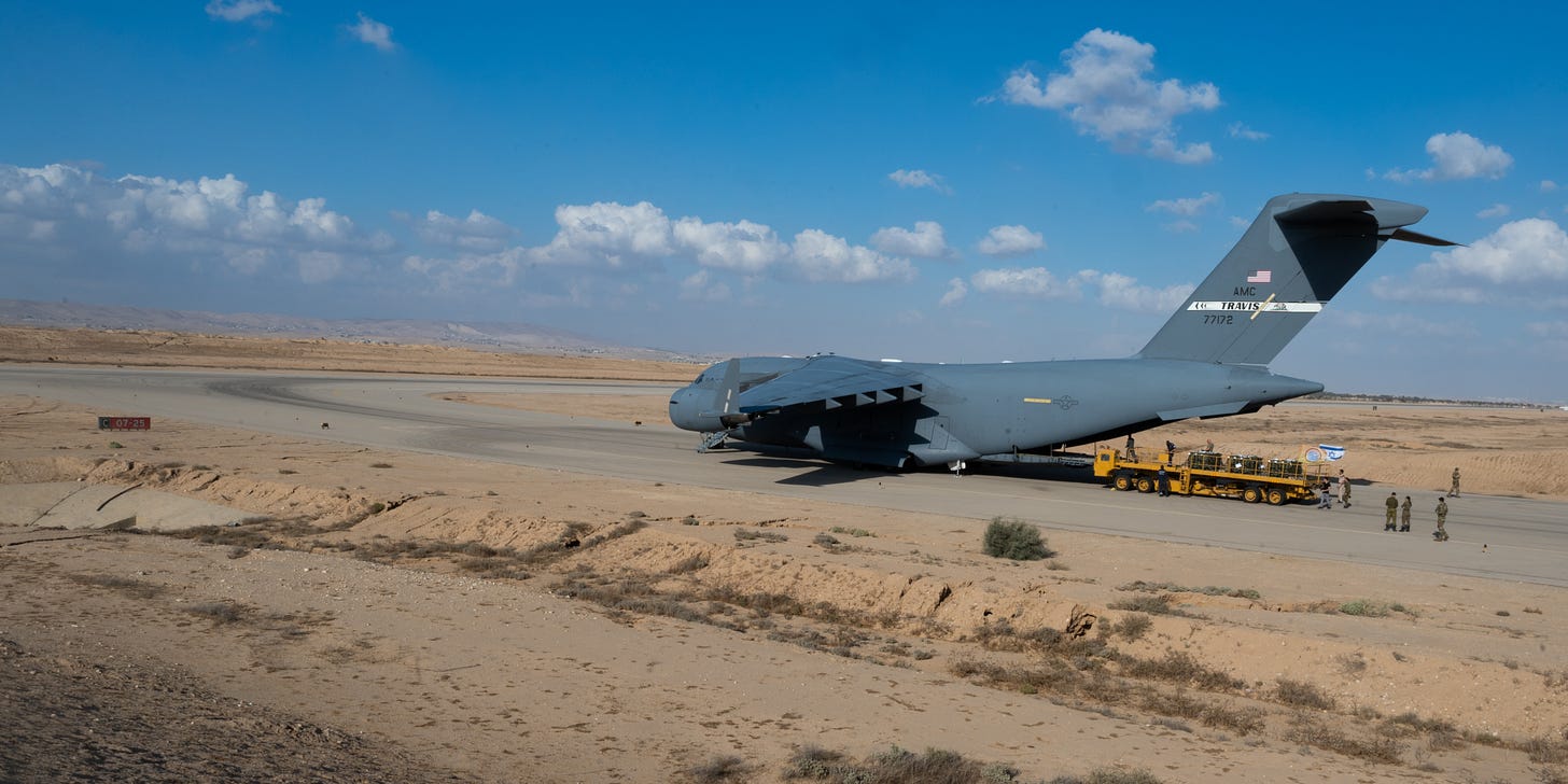 U.S. Air Force Airmen assigned to Ramstein Air Base, Germany, hand off cargo to the Israeli military, at Nevatim Base, Israel, Oct. 15, 2023.  The mission provided the Israel Defense Forces with additional resources, which includes vital munitions, and emphasized the United States’ unwavering and ironclad support for both the Israel Defense Forces and the Israeli people. (U.S. Air Force Photo by Senior Airmen Edgar Grimaldo)