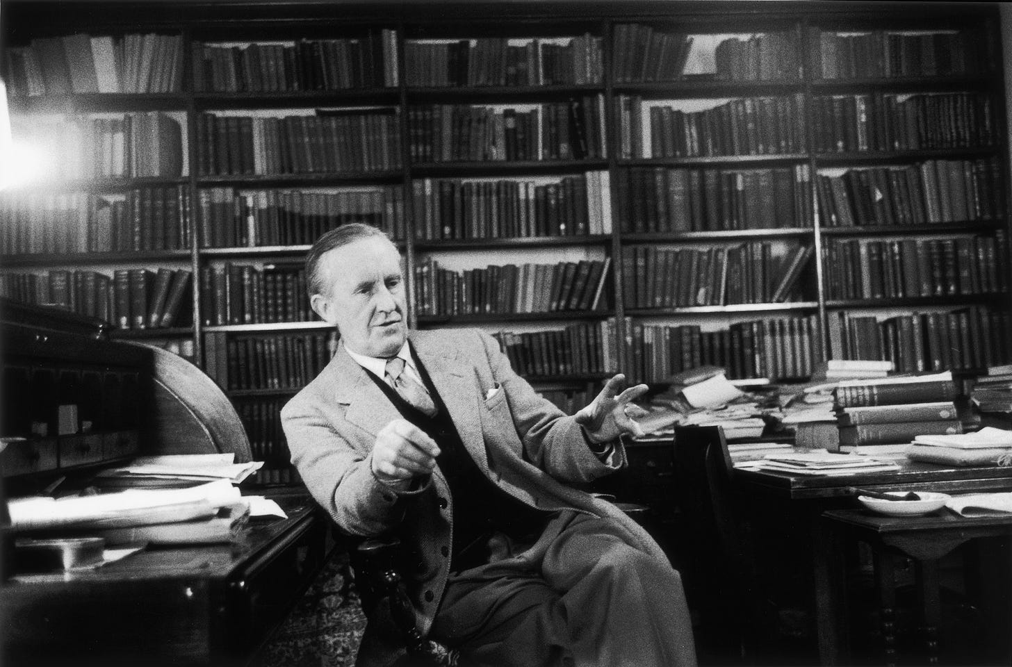 Tolkien talking with hands outstretched 