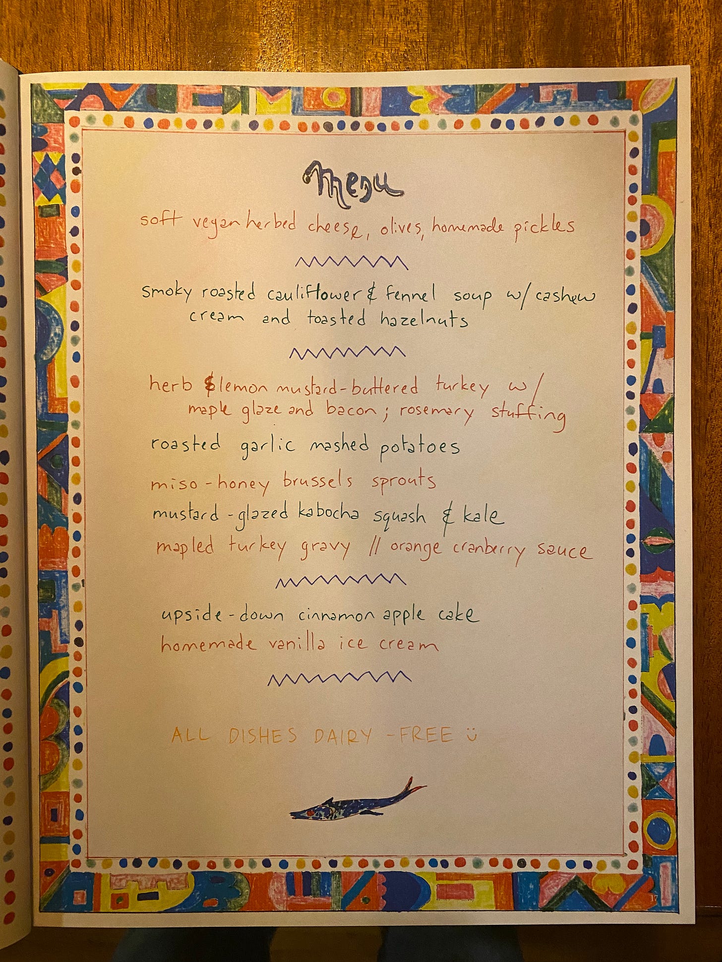 A book page that's colourfully decorated at the borders, and reads 'menu' at the top. Filled in by me is our thanksgiving menu.