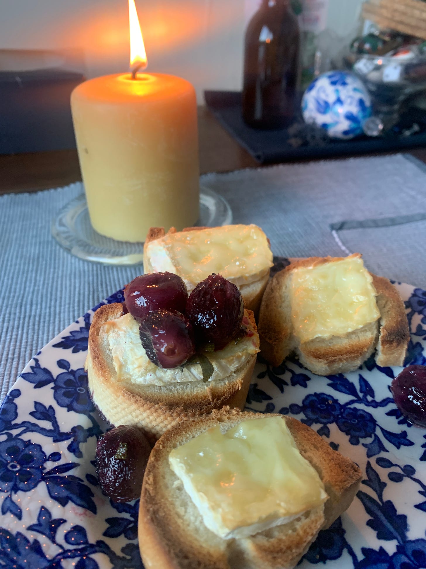 Melted brie on toasted baguette slices, topped with roasted grapes.