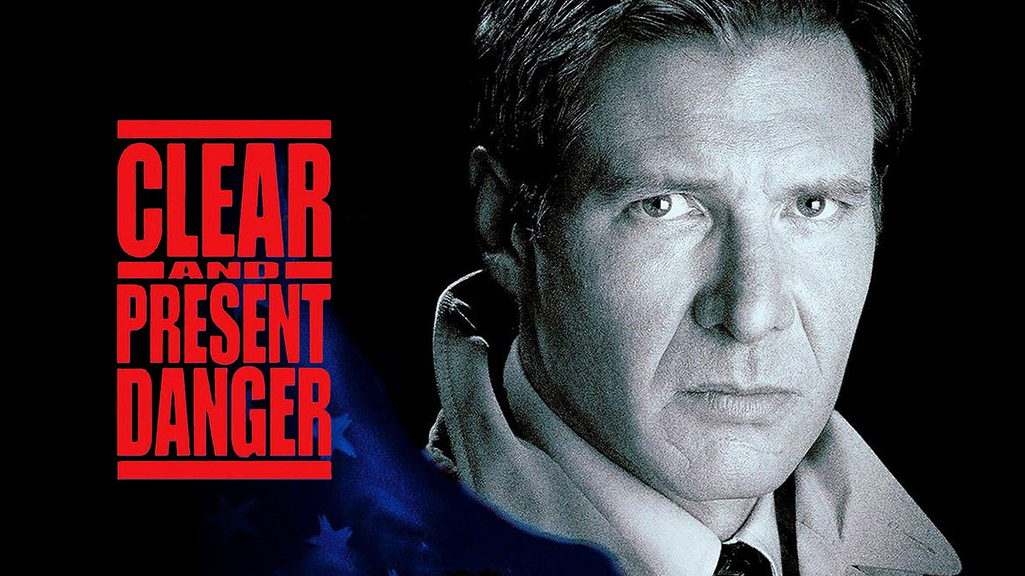 CLEAR AND PRESENT DANGER POSTER. Harrison Ford stares grimly at the camera.