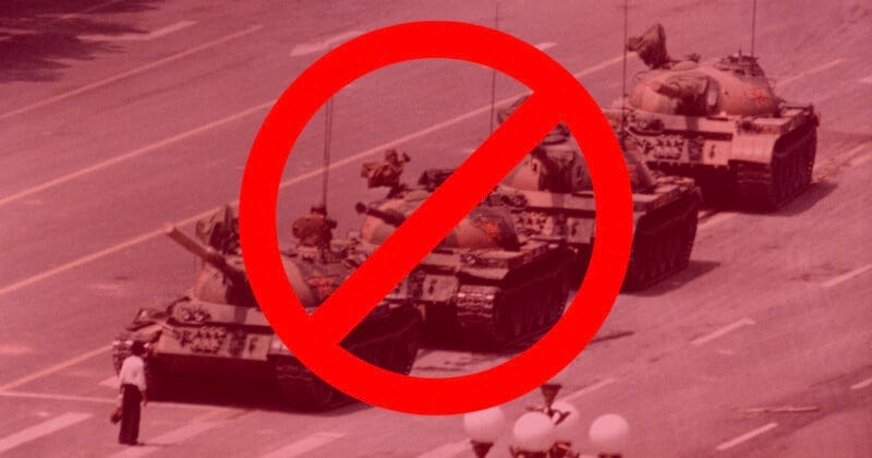 A grainy image of a lone person standing in front of a line of tanks on a road, overlaid with a large red prohibition symbol.