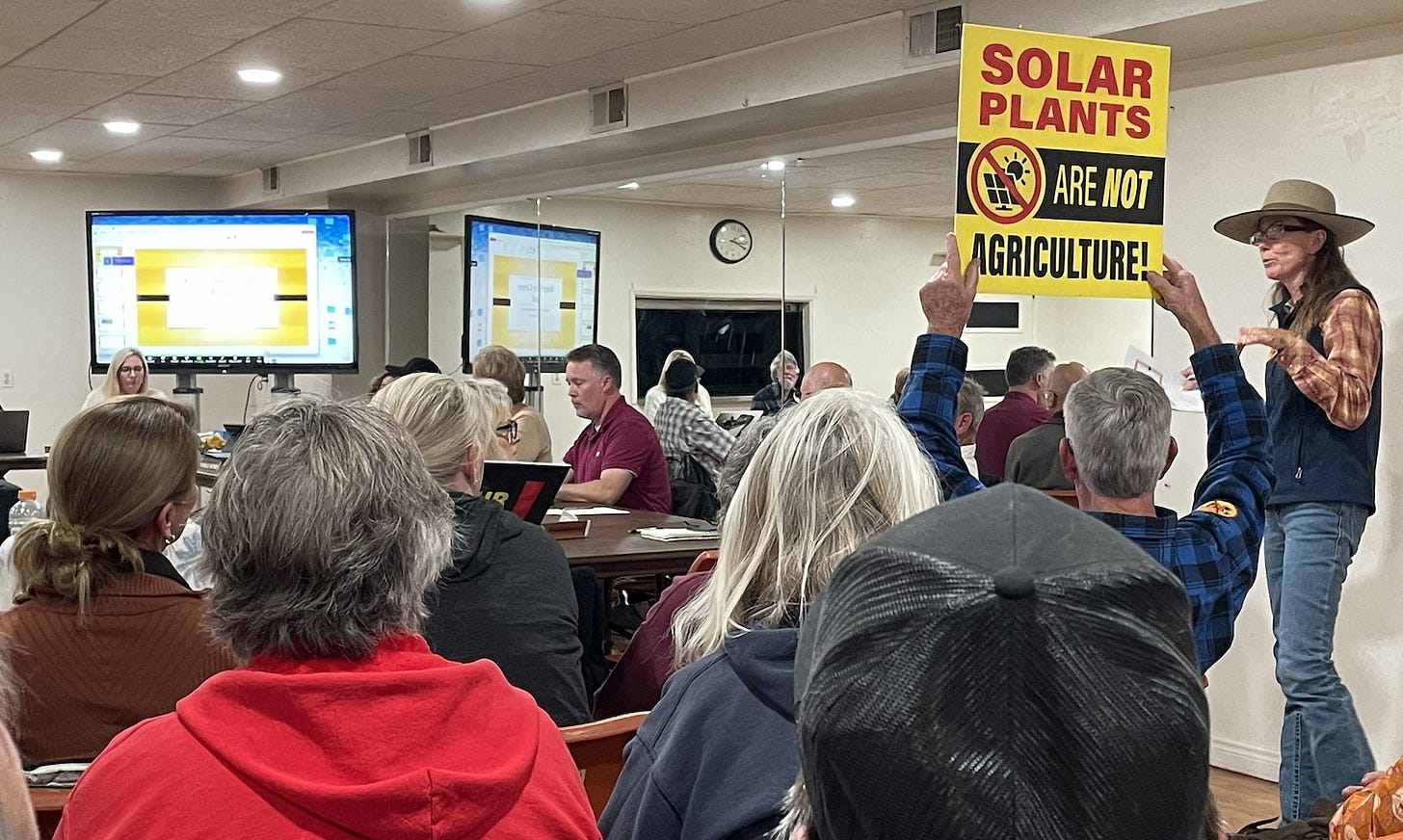 Dozens of residents in Valley Center listen to Glynn Hoekstra, right, speak against another proposal for a solar farm and battery storage facility along Valley Center Road during Monday’s Valley Center Community Planning Group meeting. Steve Puterski photo