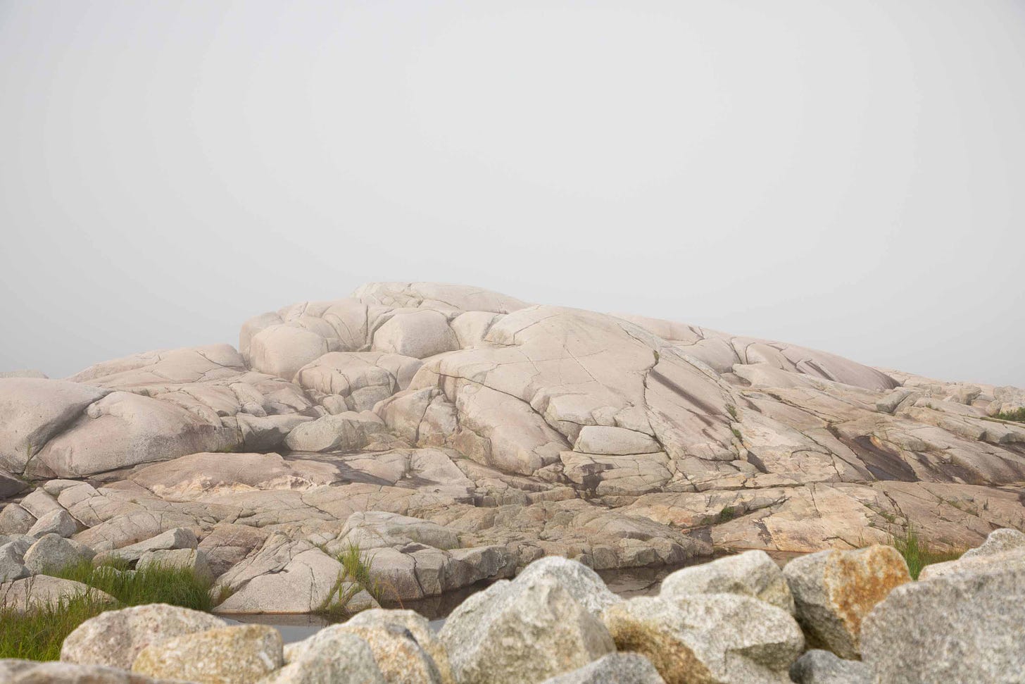 Momentarily tourist-free. Cracks in the rocks at Peggy’s Cove in Nova Scotia were carved bu glaciers that retreated during the last Ice Age, some 12,000 years ago. August 11, 2024. West Dover, Nova Scotia. Photo credit: Nancy Forde