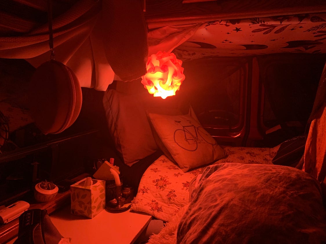 Inside a van with a red light.