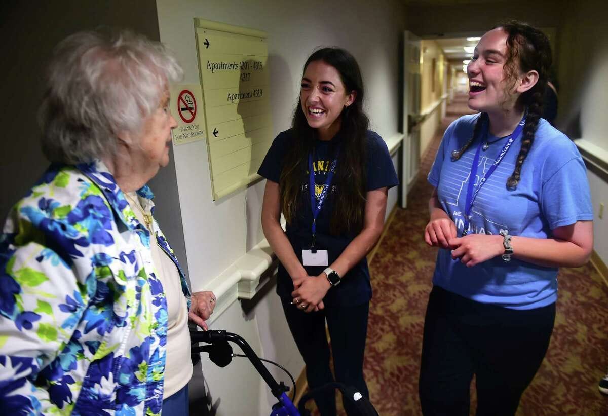 From left, Ashlar Village assisted living community resident Mary Whitmore meets with Quinnipiac University occupational therapy grad students Annmarie Allen and Elise Maiorano on move-in day for the Masonicare Students in Residence Program in Wallingford on August 15, 2023.