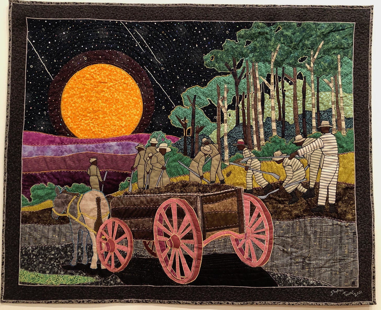 Chain gang and cart, in front of forest and an enormous moon. Stars and meteors in the sky.