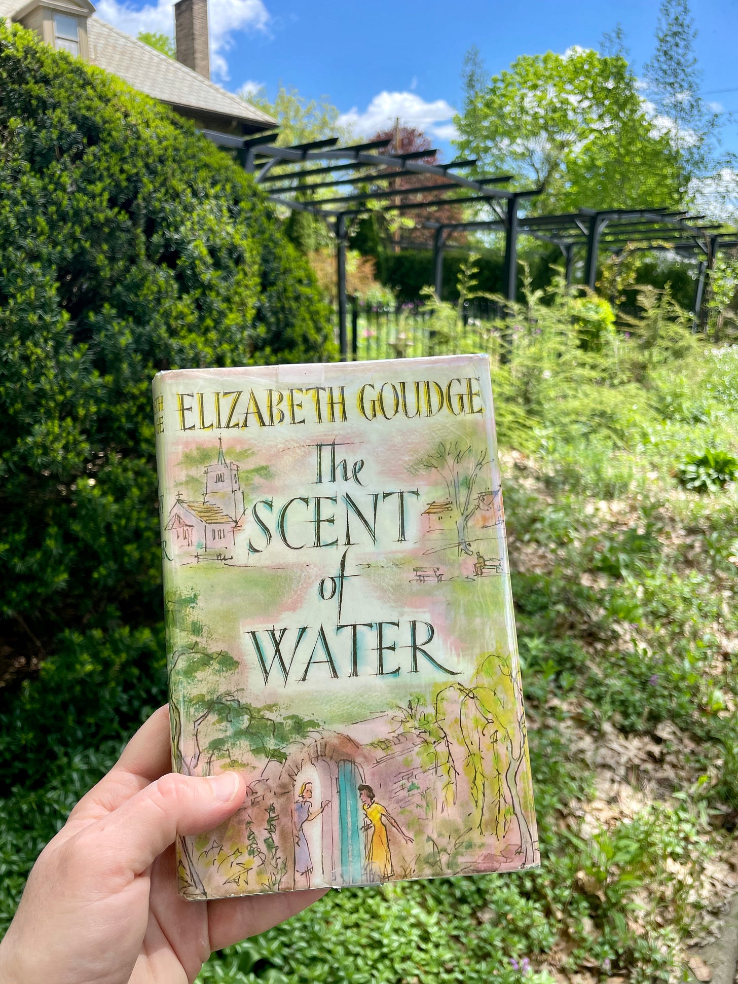 My vintage copy of The Scent of Water in front of our Cottage Garden at Havenwood. 