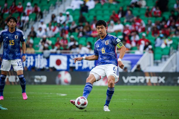 Wataru Endo of Japan drives the ball during the AFC Asian Cup Qatar 2023 Group D match between Japan and Indonesia at the Al Thumama Stadium on...