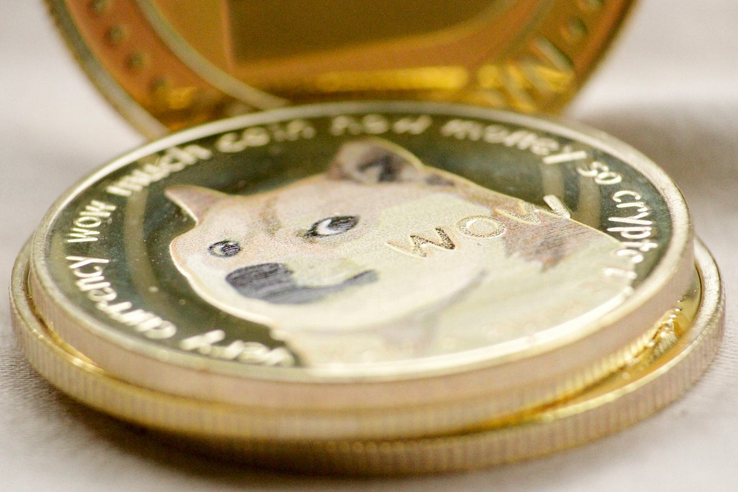 Illustration of Dogecoin, representing the cultural impact and evolving utility of memecoins in digital finance.