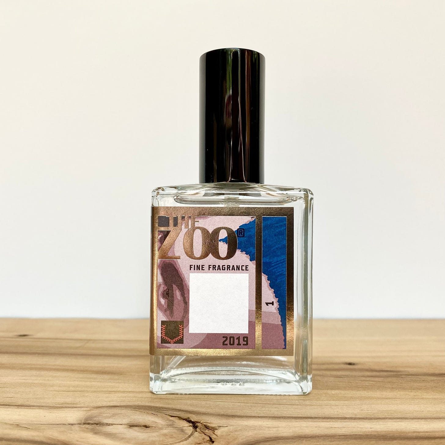 A bottle of The Zoo Carré Blanc perfume