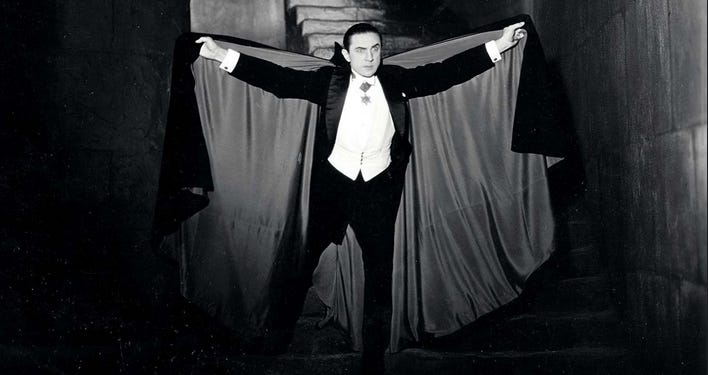 Bela Lugosi with cape outstrectched