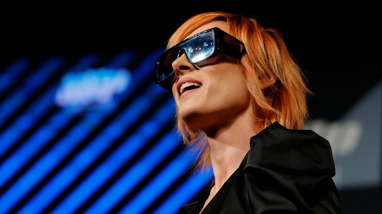 Becky Lynch smiling in sunglasses