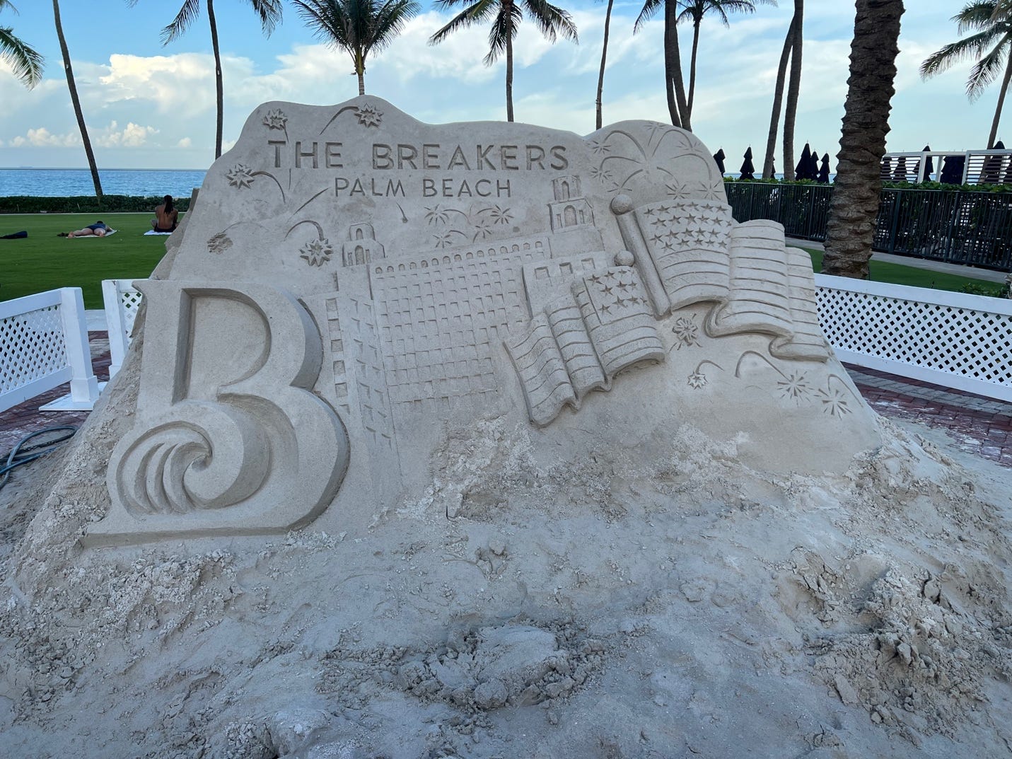 A sand sculpture of a beach

Description automatically generated