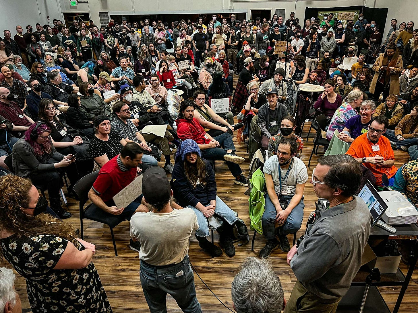 Hundreds of LGBTQ+ community members at a townhall meeting over the fate of a proposed playground at Denny Blaine, 2023. 