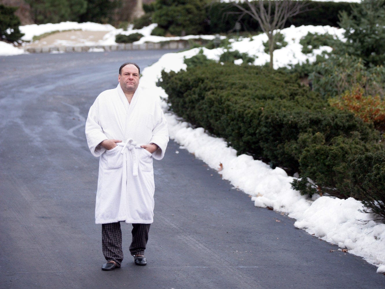 Tony Soprano wearing a white robe in his driveway