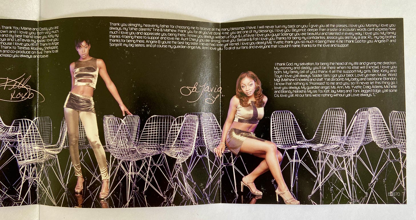 more thank yous from Kelly and LaTavia. Kelly stands in front of the chairs, while LaTavia sits and poses coyly in one of the chairs.