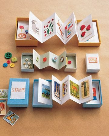 This may contain: an open book sitting on top of a table next to some buttons and magnets