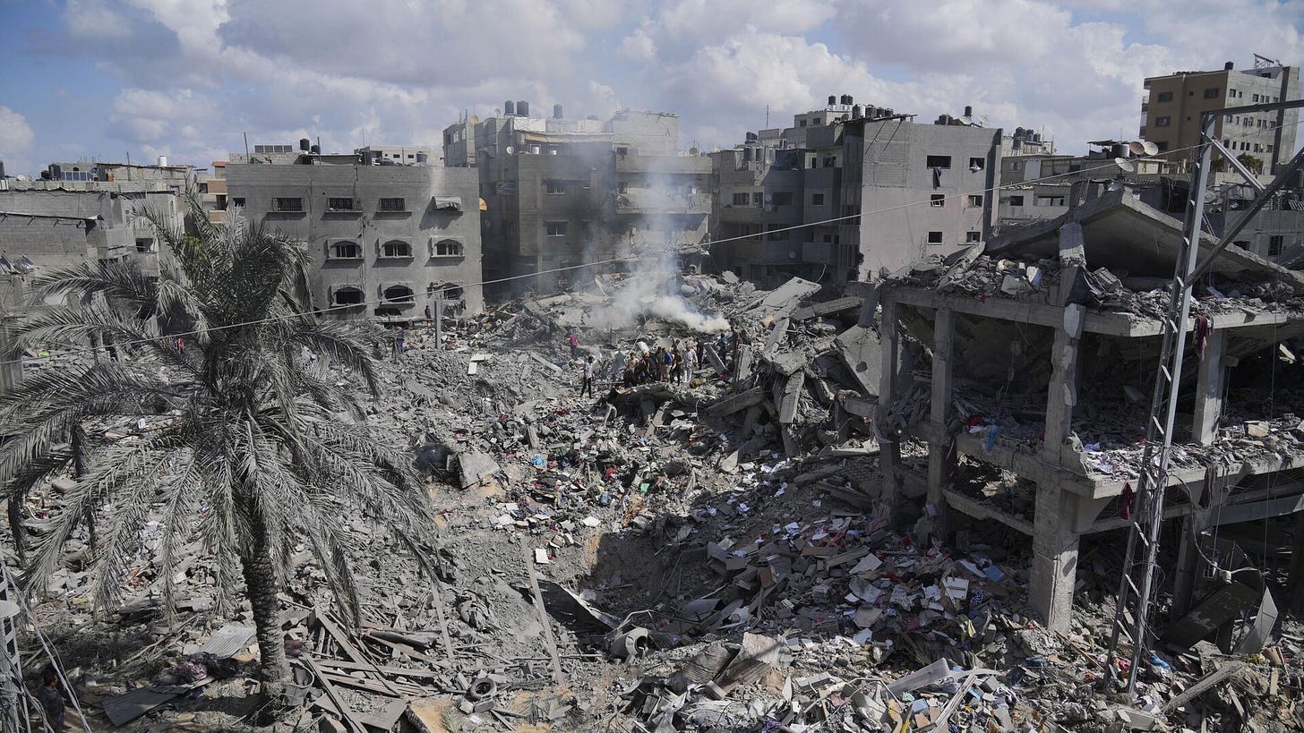 Palestinians search for the people killed in an Israeli airstrike in Bureij refugee camp Gaza Strip, Wednesday, Oct. 18, 2023 - Sputnik International, 1920, 05.02.2025