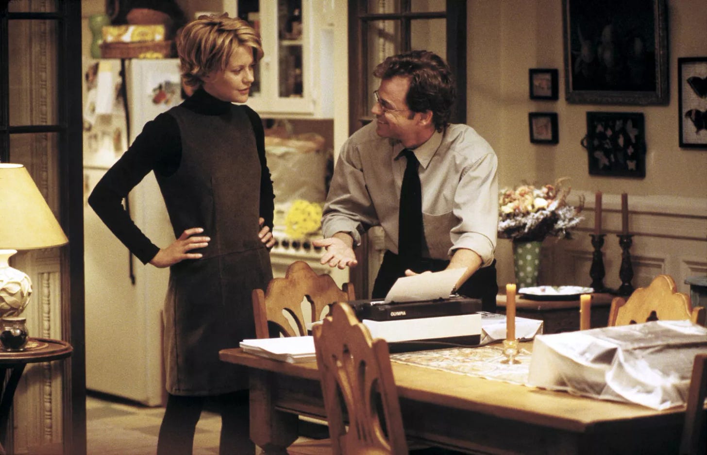 Meg Ryan wearing a green-gray jumper with a black turtleneck underneath in You've Got Mail