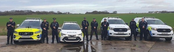Officers and police cars line up for a photo before going out on duty for a day of action in Braintree and Uttlesford districts
