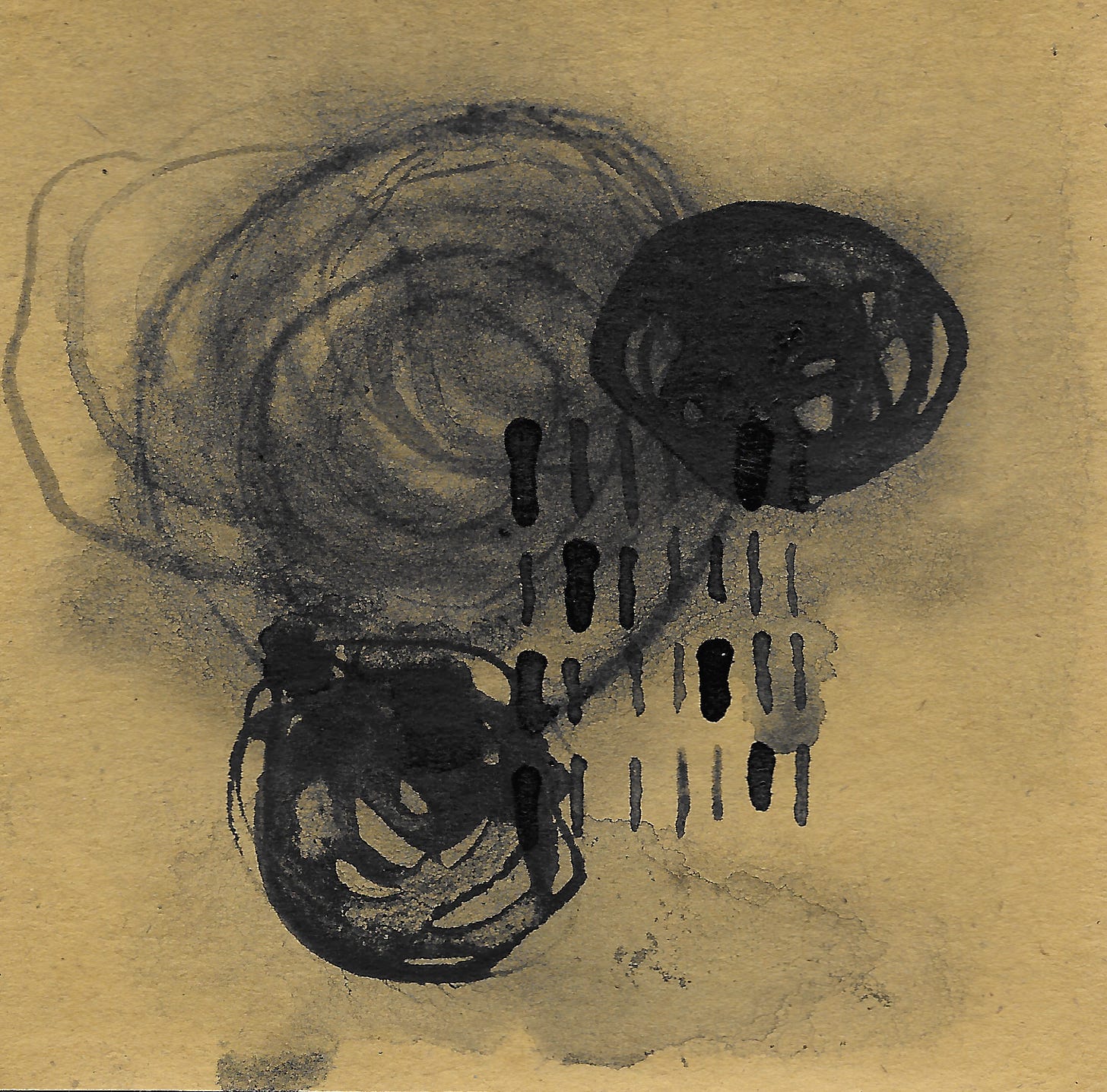 blank ink on brown paper. overlapping circles and a grid of lines.