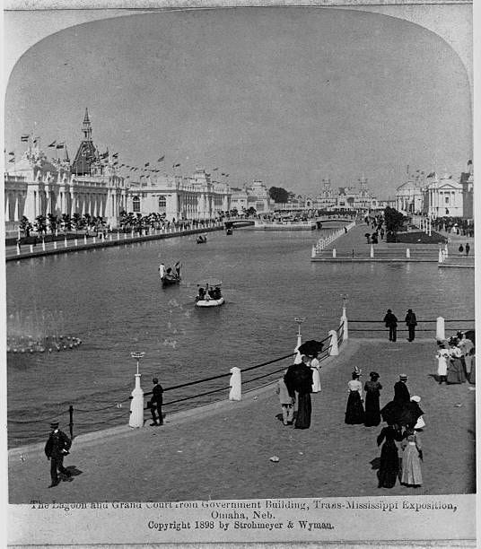 Visitors stroll on promenades or float on a lagoon pool in boats at theTrans-Mississippi Exposition in 1898. Omaha, Nebraska, USA.