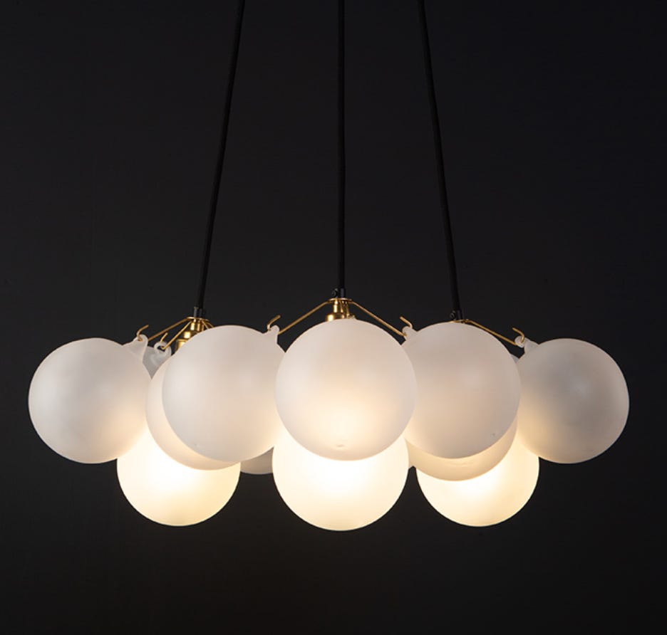 cluster of white glass balls gathered as a statement lighting