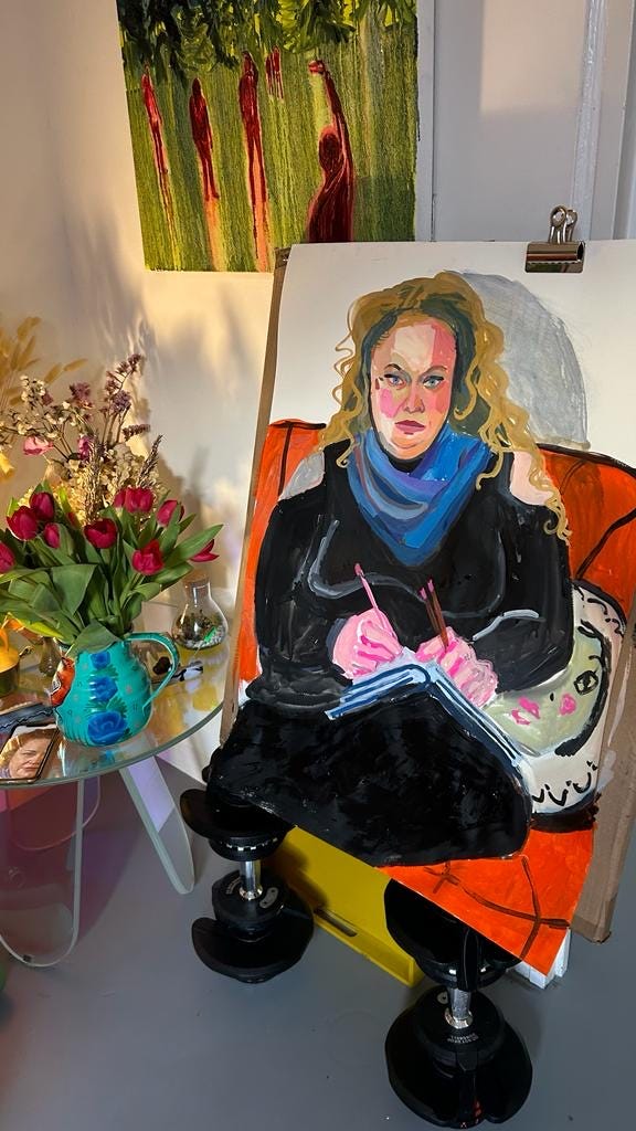 Photo of portrait of Vanessa with table and flowers beside