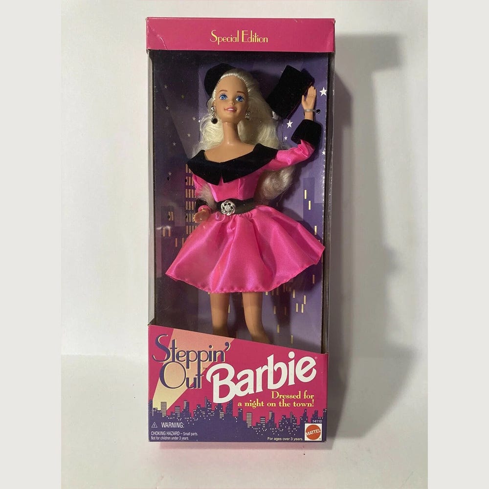 Stepping Out Barbie in special edition box wearing a pink and black velvet dress with beret