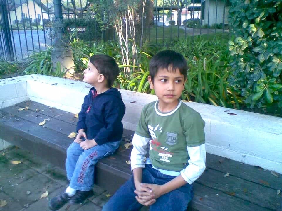 two young boys on a bench