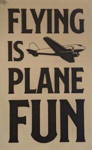 A sign in Percy Grote's apartment explains how he feels about flying. Aberdeen Insider photo by Scott Waltman