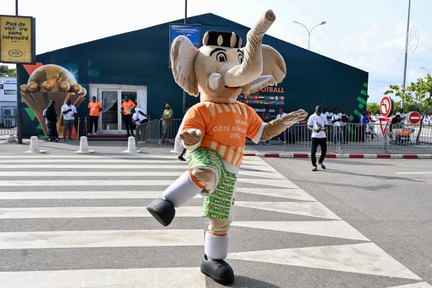 Akwaba, the mascotte of the 2024 Africa Cup of Nations performs ouside the Felix Houphouet-Boigny International airport to welcome guests ahead of...